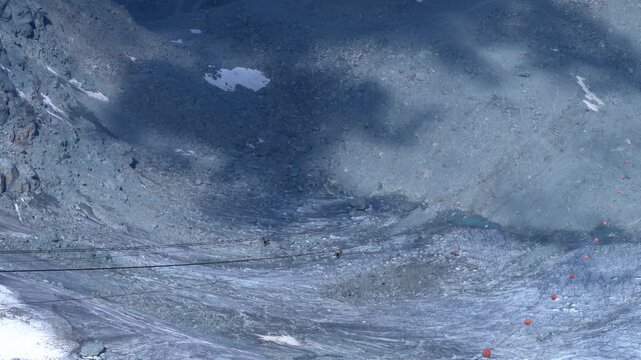 Zipline Rider Above Tortin Glacier and Cloud Shadows
