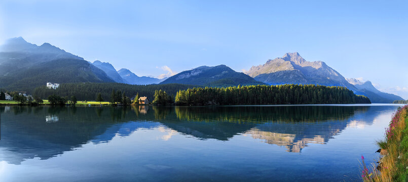 Lake Sils and the Chaste island in the morning with reflection in Sils Maria / Segl, St Moritz, Canton Grisons, Switzerland