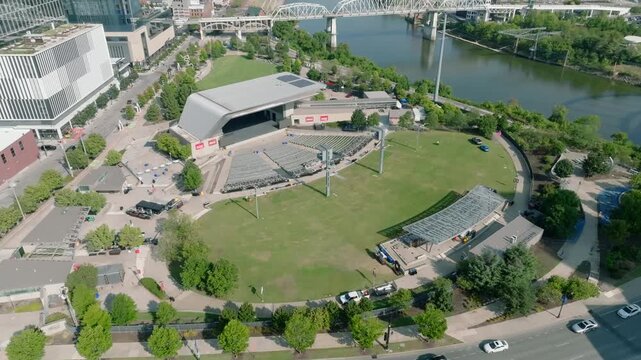 Alongside First Avenue is Ascend Amphitheater, captured with a drone along the riverfront, with a bridge in the background and traffic in the foreground.