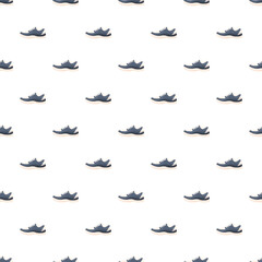 Fototapeta premium Sneakers creating a repetitive footwear pattern on a white background