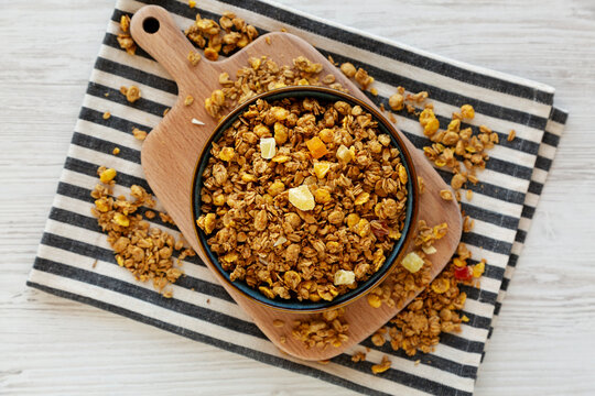 Crispy Granola with Tropical Fruits in a Bowl, top view.