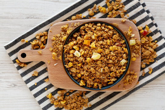 Crispy Granola with Tropical Fruits in a Bowl, top view.
