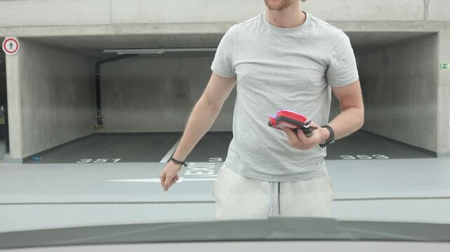 Car owner closes the hood after successfully repairing his broken vehicle then walks away celebrating the successful fix with joy pride relief and satisfaction with pride