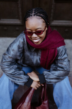 High angle view of a stylish Black woman smiling