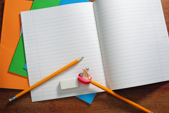 Open Lined Notebook with Pencils
