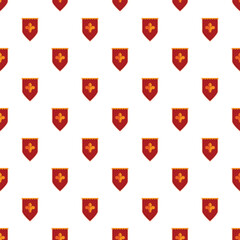 Repeating red heraldic shields with a golden fleur de lis symbol creating a seamless pattern © nsit0108