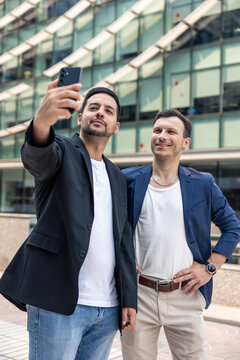Technology startup founders taking selfie outdoors
