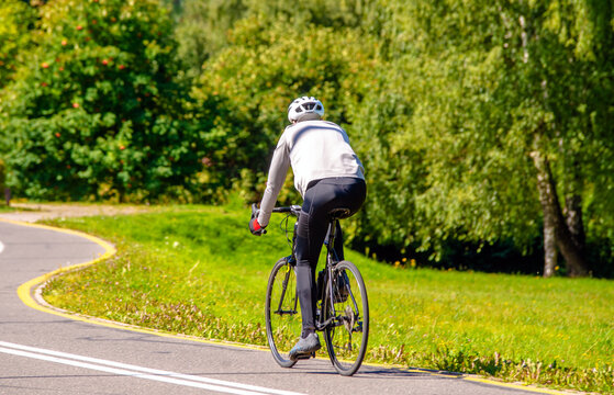 Cyclist ride on the bike path in the city Park
