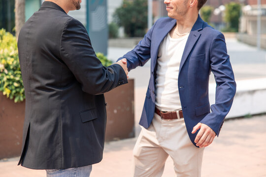 Business partners shaking hands creating a new agreement