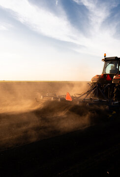 Tractor preparing the land for a new crop planting