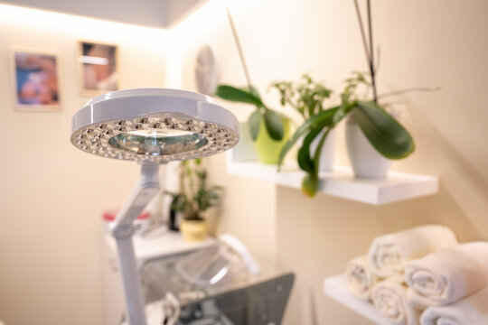 Selective focus on professional round magnifying LED lamp in cosmetology room