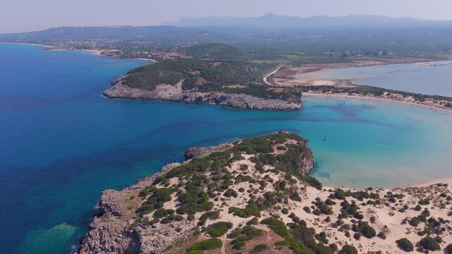 Aerial Drone View of Voidokilia Beach, Turquoise Ionian Sea, Rocky Headland and Lagoon in Messinia, Peloponnese, Greece