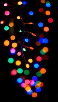 Colorful Christmas Lights Bokeh Background with Blurred Garland