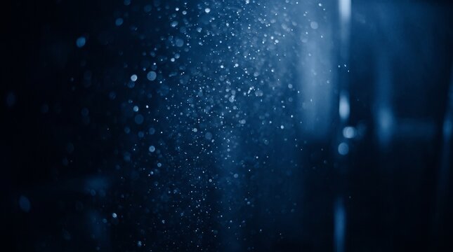 Floating Blue Dust Particles in Dark Room with Beam of Light