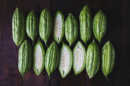 Fresh bitter melons on the dark background