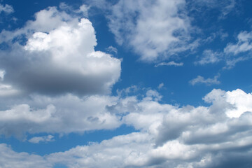 Obraz premium Summer morning blue sky with clouds, macro.