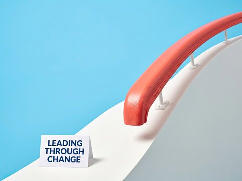 Coral handrail with a leading through change note on white ledge ideal for business content symbolizing direction and guiding progress