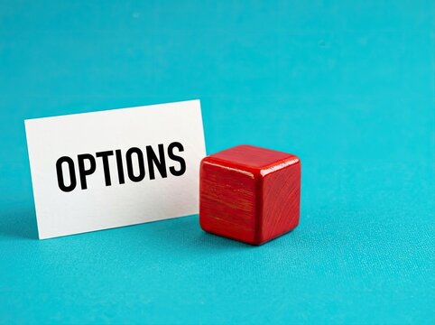 White card with options text next to a red cube on blue background suitable for strategic marketing symbolizing decision making and choices