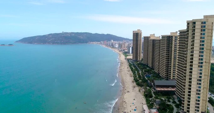 Aerial view of beachfront towers and sandy coast at Dadonghai Bay, Sanya, Hainan, China