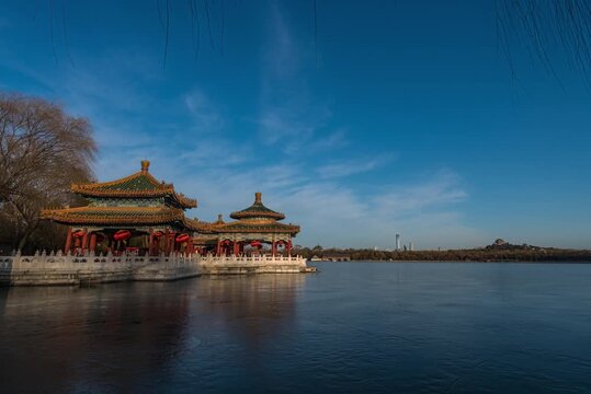Traditional Chinese pavilions on frozen lake in Beihai Park, Beijing in Beihai Park, Beijing, China