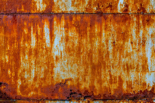 Close-up of Weathered Rusty Metal Surface with Peeling Paint