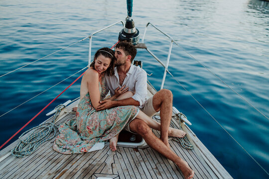 A man and woman enjoy a romantic sailing vacation in Ibiza