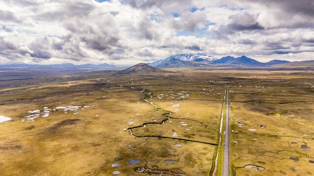 Aerial view of M��rudals�r�fi with road 910 and volcanic mountains