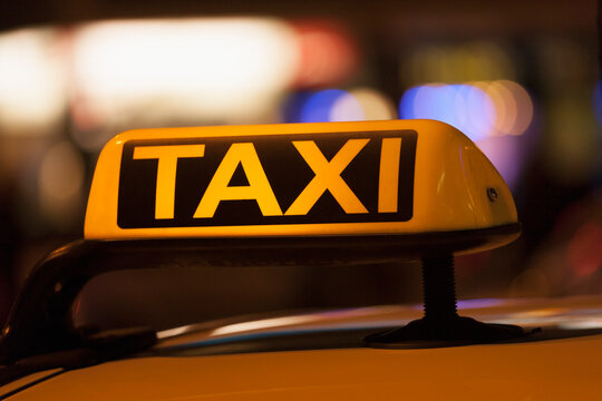 Germany, Bavaria, Munich, Illuminated sign on taxi showing availability