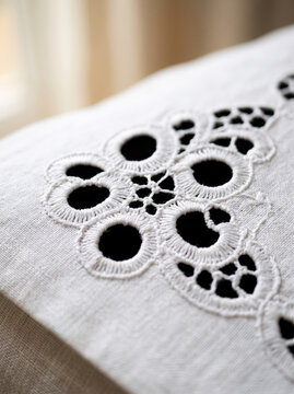 Crisp white broderie anglaise cutwork eyelet embroidery on cotton napkin