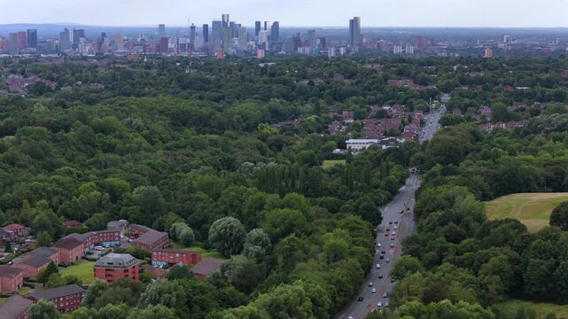 Aerial video of Manchester Skyline Viewed Across Heaton Park Greens