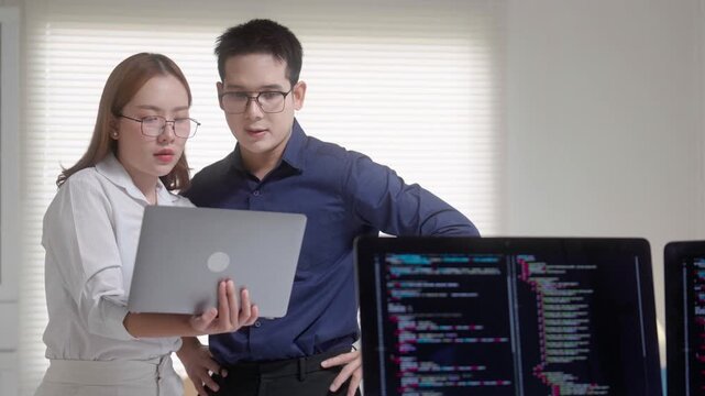 Software Developers Collaborating on Coding Project
