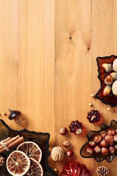 Autumn frame with leaf shaped glass dishes on wooden table vertical