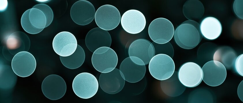 Versatile wide format abstract background featuring overlapping soft mint and teal bokeh orbs on deep dark backdrop. Ideal for tech, wellness, luxury branding, and festive design overlays.