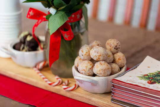 Apricot coconut balls on table set for Christmas lunch