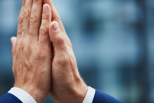 Business professionals joining hands in a high five