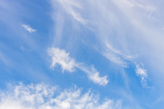 Clear sky with soft, feathery clouds
