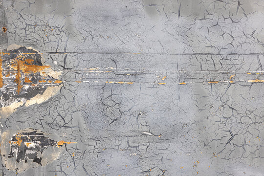 Weathered Metal Surface with Peeling Gray Paint and Rust