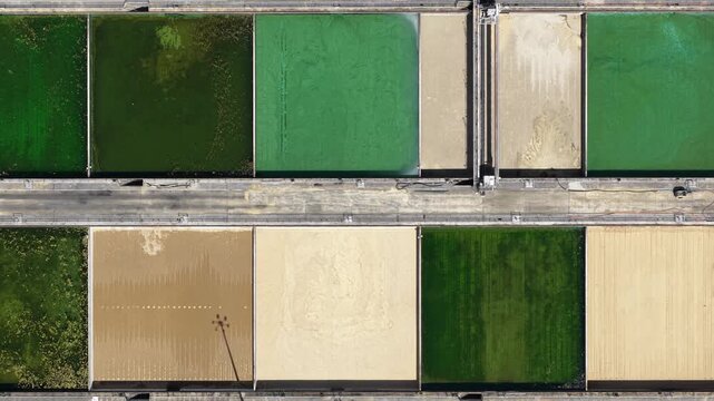 Aerial top down view of wastewater treatment plant basins