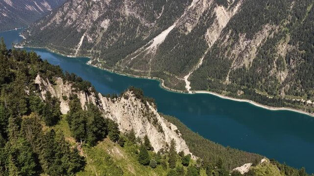 Lake Plansee forested slopes and rugged limestone peaks Reutte district of Tyrol, Austria
