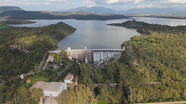 Aerial View Of Lago Di Monte Pranu Dam And Reservoir Surrounded By Forests And Mountains In Sardinia, Italy.