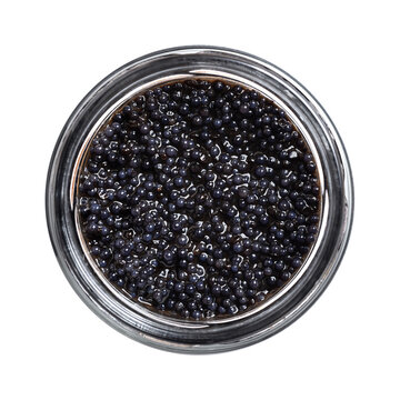 Black caviar made from lumpfish roe, in a glass jar, isolated from above. Affordable, small, deep black dyed, salted fish eggs, from Cyclopterus lumpus, also called lumpsucker, used as garnish. Photo