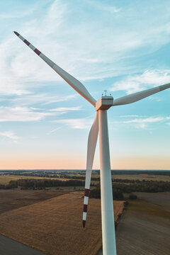 Scenic view of wind turbine on cultivated land