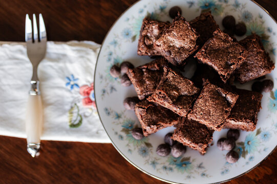 stack of chocolate gluten free brownie slices on plate at party