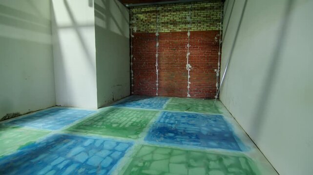 Doorway frame looks into room with decorative geometric floor patterns. Background features brick wall prepared for plastering and finish