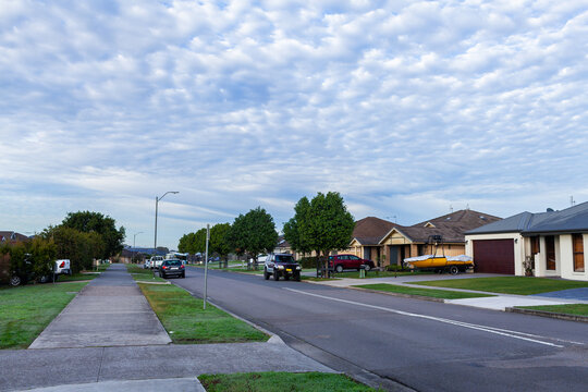 Quiet morning streetscape scene with dramatic Altocumulus clouds