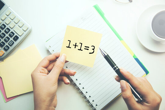 1+1=3 text on white paper