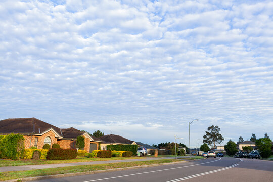 Quiet morning streetscape scene with dramatic Altocumulus clouds