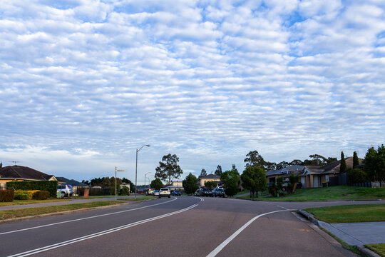 Quiet morning streetscape scene with dramatic Altocumulus clouds