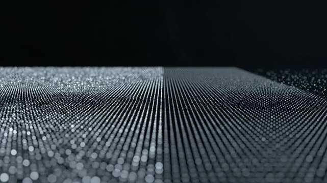 Silver point field forming a raised central platform between scattered particle edges, seamless monochrome grid loop on black with low angle depth, subtle surface motion, and clean upper copy space