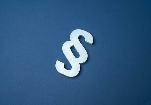 Paragraph symbol. Laws and regulations define legislation, contracts and obligations. Legal rules support compliance, justice and protection of rights.